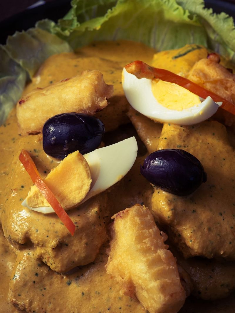 A la huancaína with egg and black olives
