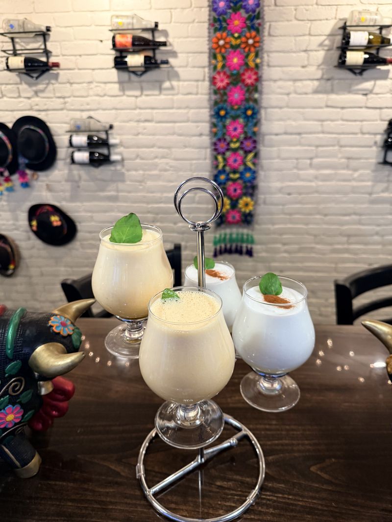 Pisco sours on the bar at Coya