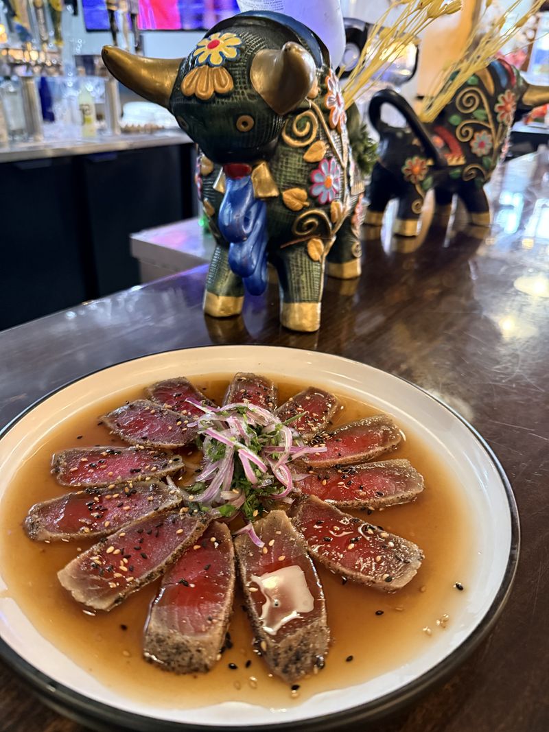 Seared fish in a bright citrus sauce with red onion